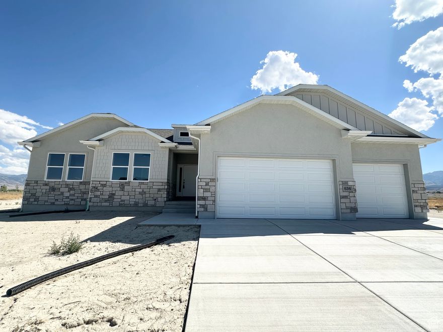 Beautiful home on a half acre lot awaiting you and includes a water share! It is in a new beautiful community, schools and shopping close by, easy access to the freeway, and recreation. Quality home built with 2x6 exterior framing, extra insulation, quality windows allow this home to have maximize on energy use. Great master suite, wonderful floor plan, 240 SF covered patio to enjoy the evening mountain views. On demand water heater, water softener, gas fireplace....some nice bells and whistles to come home to! Samuel Clegg Signature Homes, check it out today.