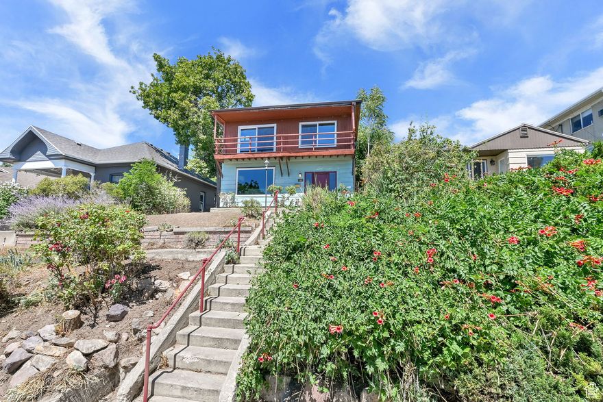 A time capsule beach-house style Avenues property, owned for decades and decades (AND DECADES) by the same family - on the market for the first time since the 1950s. Sold AS IS. Southern exposure views of the valley from the main level and second-floor suite. Many upgrades: newer double-pane windows and sliding door; newer electrical masthead; nearly all new kitchen appliances: Samsung SmartThings range, exhaust fan, dishwasher, stainless-steel basin kitchen sink, and faucet; new tile backsplash in main-floor bathroom, plus new toilet and bath surround; and new LVP flooring in kitchen and main-floor bathroom. Plus the long-time groovy features, too: front door sidelights, wide-open entry with step-up to living room, wrought-iron staircase railings to second level; wood paneled walls; cool and vintage-y sculpted green carpet (worn in spots), and green swirling marbleized-look laminate kitchen counters; a few mid-century light fixtures; wood-burning stove connected to fireplace, large formal dining (or could be den or family room), and so many built-in bookcases! Eat-in kitchen, main-floor laundry. Carport, sheds and cellar equal plentiful storage. Roses and lavender, and a lot that is prime for vision and a refresh. This, and all the good reasons to live in one of coolest, most historic neighborhoods in Salt Lake City. A quick drive to the airport. Close to Downtown, foothills, the University of Utah, cafes, coffee shops, and an array of services mere blocks away.