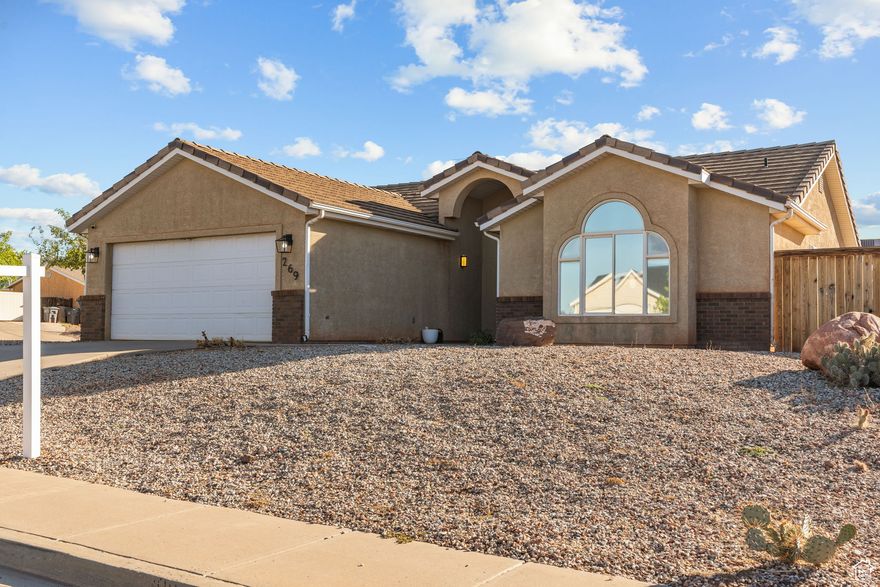 Welcome to this beautifully updated single-level home in the heart of Ivins, surrounded by stunning red rock views! Very close to the new Black Desert Golf Course and Resort! Featuring 3 bedrooms and 2 bathrooms, this home was remodeled in 2022 with modern finishes throughout - including a refreshed kitchen, updated flooring, and fully renovated bathrooms. The plumbing has been updated as well, offering added peace of mind.  Enjoy the low-maintenance lifestyle with a fully fenced yard and brand new turf installed in 2023-perfect for relaxing or entertaining without the upkeep. Located in a quiet neighborhood with no HOA, this home is just minutes from local elementary schools, Rocky Vista Medical School, and outdoor recreation.