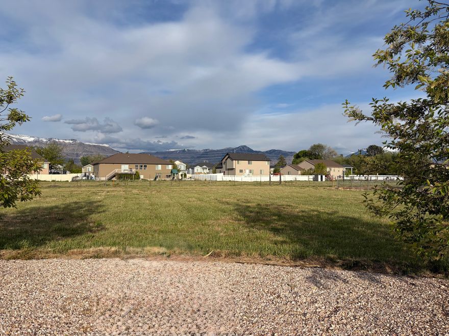 Build your dream home on this prime residential lot featuring stunning mountain views.  Desirable west facing orientation is perfect for backyard shade in the evening, beautiful front-of-home sunset views, and snow will melt faster on driveway!  Located in an established neighborhood with mature surroundings, this property offers the perfect setting to design and build a home that fits your lifestyle.
