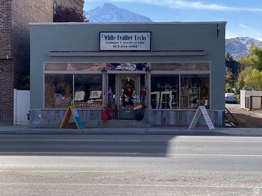 Difficult to find commercial property with Main St. frontage in growing Santaquin. Street and sidewalk traffic. Current location of White Feather Rocks. Property includes the alley to the back of the property where several parking stalls are located. Parking in front of the store on Main St. also. The building currently has a spacious show room, office, restroom, craft area, rock cutting area and unfinished basement. The laundry room had been a 2nd bathroom. Sellers are open to selling some of the items currently in the building such as, display cases, machinery etc., ask about these items if interested when touring the building. Many potential uses include retail space, restaurant/deli, dance studio, hair/nail salon, etc.... Please show during regular business hours of 10am - 6pm Tuesday through Saturday. Can also be shown on Mondays. Welcome to your new business location.