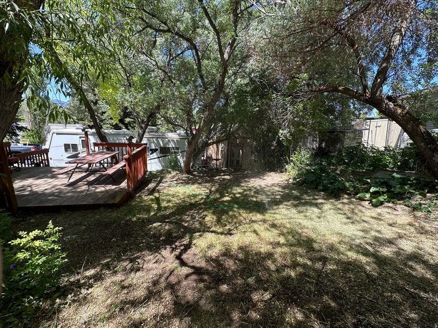 This lot is tucked into a marvelous spot in the park.  It has trees for shade and is ready for you there are 2 trailers, a deck, stairs, a on site bathroom with a toilet and sink inside.  If you  don't want the trailers the seller will remove them.