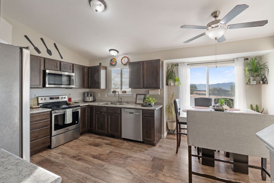 Charming 4-Bedroom Home in a Peaceful Tooele Neighborhood with No HOA! Welcome to this beautiful single-family home nestled in one of Tooele's most desirable, family-oriented neighborhoods. Featuring 4 spacious bedrooms and 1  baths, this home offers the perfect blend of comfort, style, and functionality. Step inside to discover vaulted ceilings and an updated kitchen that give the home a bright, modern feel. Recent updates include a new roof, gutters, and siding (2024), as well as a new fence and newer AC and furnace, ensuring years of worry-free living. Enjoy the extra space with the new concrete RV parking, and relax in your private backyard with no back neighbors-a peaceful retreat for family gatherings or quiet evenings. Note: another room in the basement needs a closet to make it a 5-bedroom house.