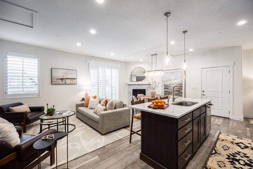 Refreshed interiors with a brand new price, enjoy the ease of mountain living in this beautifully maintained Pinebrook Quarry Springs townhome, ideally tucked on a quiet cul-de-sac and backing up to complete open space, ready for the Park City adventurer! Bright, open living with a well-appointed kitchen featuring a Bertazzoni oven, dining area, and Juliet balcony with views of the Eastern Mountain Range. The main-level primary suite includes a spacious ensuite bath, walk-in closet, and access to a peaceful covered deck overlooking a natural red rock yard, perfect for morning coffee, afternoon reading, and quiet, private moments in nature. The top level features two generously sized ensuite bedrooms ideal for hosting family or guests. Dual thermostat controls for the upper and main living areas allowing you to independently tailor temperatures on both the main and upper living areas. The lower level offers an attached 2-car garage plus 361 square feet of versatile storage-perfect for a gym, office, gear room, future theater room, the potential is abundant. The convenient, walkable Quarry Club House includes a large outdoor pool and spa, with easy walk/bike access to Quarry Village, Whole Foods, and nearby trails. Just minutes to Woodward Park City, world-class skiing, and convenient I-80 access for commuting, this location makes it easy to live, play, and connect year-round.