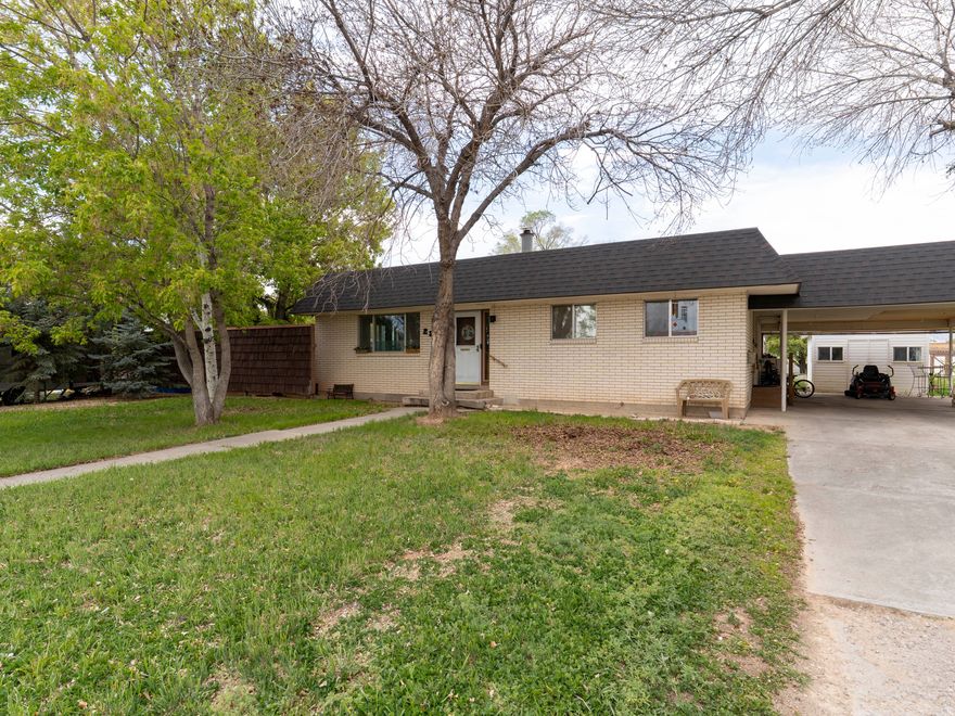 Rare in-town opportunity on a spacious .81-acre lot located on a quiet street with no neighbors behind or to one side. This single-level home offers 3 bedrooms and 1.5 baths, mature trees, multiple storage sheds, and a water well. The large lot provides exceptional privacy and room to expand, garden, or enjoy outdoor space-an uncommon find this close to town.   Square footage per county records. Buyers are advised to obtain their own measurements.