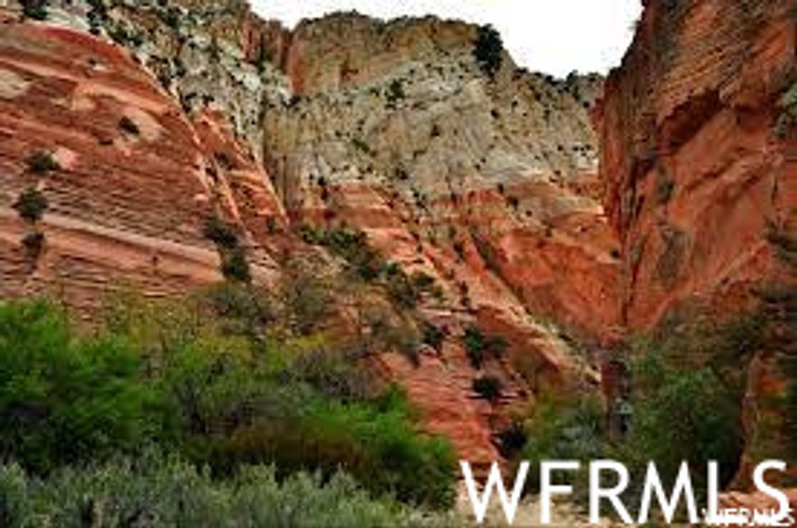 Incredible Lot! Red Valley Heights Phase 1 with .38 acres overlooking highway 89, and Orderville valley with magnificent white cliffs as a backdrop. Sitting at the base of Red Hollow Slot Canyon trail. Enjoy the old original Main Street US-89, rich Utah history, best temperatures in the state, small town living at its finest with utilities brought to the front of each lot. 18 acres open space behind the lot. CC&R's but no HOA, best of all worlds. Red Valley Heights is just minutes away from Zion National Park, Bryce Canyon, Kanab, and 1 hr and a half from Lake Powell. These lots are going fast! Square footage figures are provided as a courtesy estimate only and were obtained from surveyor report. Buyer is advised to obtain an independent measurement.