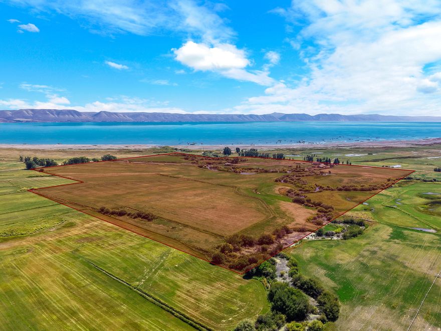 Rare opportunity to own 99.21 acres of wide-open space paired with a 3,022 sq ft custom home, offering privacy, views, and endless potential. Set back from the road and surrounded by expansive acreage, this property delivers the perfect balance of comfortable living and room to roam. The spacious home features generous living areas, large windows that capture the surrounding landscape, and a functional layout designed for both everyday living and entertaining. With over 3,000 square feet, there is ample space for gathering, hosting, and creating a true retreat. The 99.21 acres provide outstanding flexibility - ideal for livestock, recreation, farming, investment potential, or simply enjoying your own private slice of the countryside. Whether you're looking for a primary residence, legacy property, or land with long-term opportunity, this property offers space, freedom, and possibility that's increasingly hard to find.