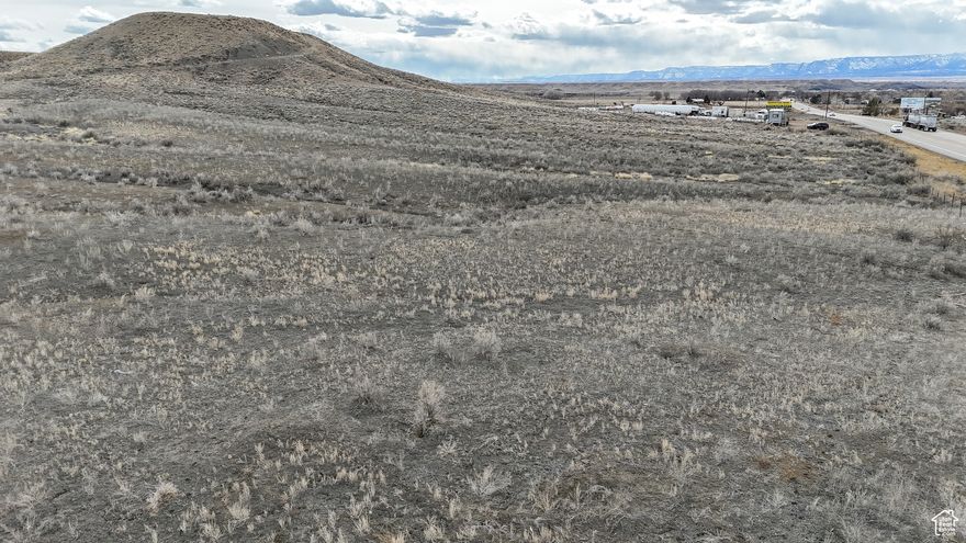 Prime Commercial Property on US Hwy 6! Attention business owners and investors! This exceptional property is located on US Hwy 6, one of the busiest routes connecting Denver and Salt Lake City. Serving as a key shortcut between I-15 and I-70, this location offers unmatched visibility and high traffic exposure. Whether you're looking to expand your existing business or start a new venture, this property provides ample space and a strategic location along a highly traveled corridor. Don't miss out on this rare opportunity to secure a prime piece of commercial real estate. NOTE - This property is in the county, but is directly east of Wellington City just outside the limits. Square footage figures are provided as a courtesy estimate only.  Buyer is advised to obtain an independent measurement.