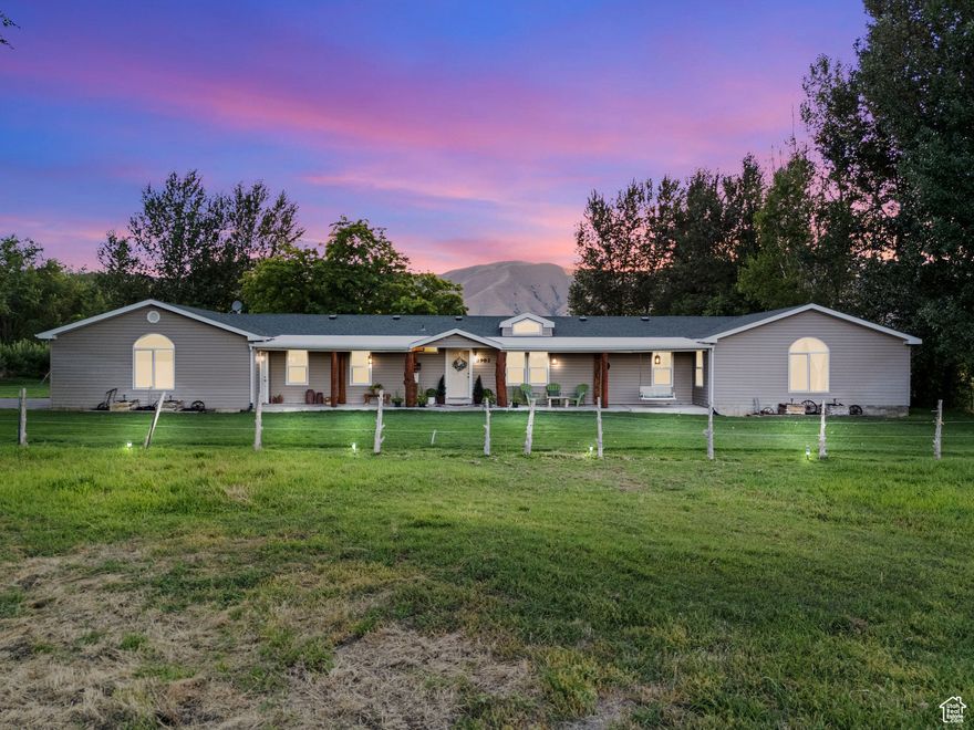 LOCATION, LOCATION, LOCATION! Welcome to your own little paradise sitting on 5.25 acres of lush green ground. This property is a DREAM offering horse property for all your animals to roam and where a stream runs through giving off water year-round. This stream also offers a great fishing spot for the family. You can't beat these views! The property is greenbelt making it cheaper for property taxes but getting the full benefits of owning more land. The home is part manufactured 24' wide and also has been added onto the North end that has been stick built in 2004. It offers TWO master bedrooms with full bathrooms in each room. This open concept of living offers plenty of room, lots of closet space including walk in closets and a big pantry. This home has a 1,000-gallon propane tank that is owned, a personal well that is artisan which pumps 20 gallons per minute, central heating and air that is only a year old, and an oversized two car garage (775 sq feet) that could potentially have a third door added if desired. There is a dog run that can fit 4 dogs, along with a playset and tramp that will stay with the property. Don't miss out on this beautiful piece of paradise! **The extra freezer and refrigerator are excluded.** All square footage information was received by Utah County records, Buyers agent to verify or get an independent measurement.