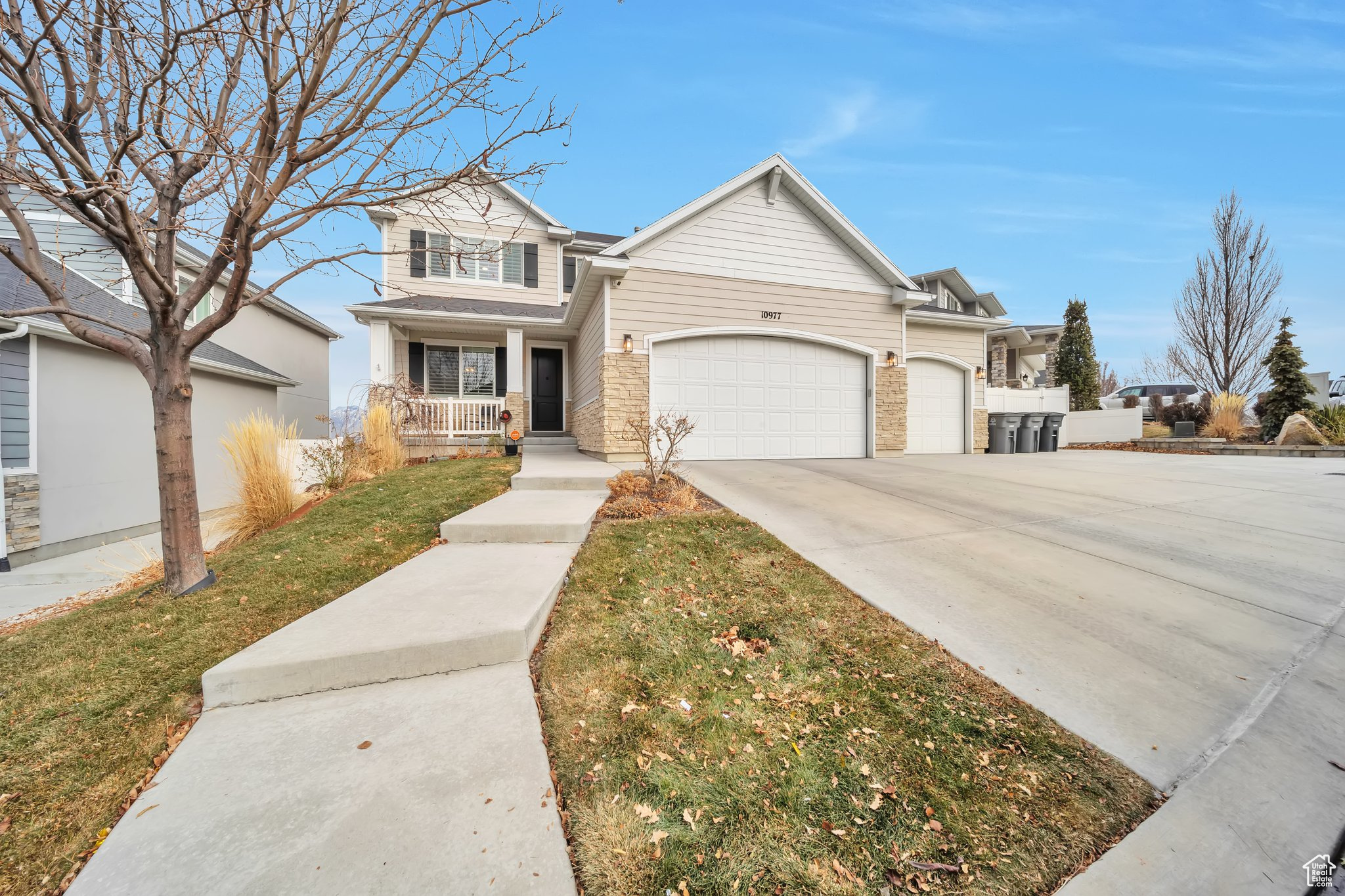 Come view this beautiful 2 story home located in the heart of South Jordan.  minutes from the Oquirrh Mountain Temple, shopping, movie theatres, and great dining options.  This 4-bedroom, 2 and a half baths feature an open floor plan with high ceilings with lots of natural light. A gorgeous kitchen with stainless steel appliances, gas range and polished granite countertops, upgraded flooring, lighting and plantation shutters.  Smart Home features include a Vivint Alarm system, doorbell camera, Nest Thermostat, and 4 exterior cameras. You'll love the oversize master bedroom with vaulted ceilings, grand master bath with a large walk-in closet.  Large 3 car garage with side mounted smart garage door openers allows for a plethora of storage options, lastly all the workbench and cabinets are included on the back wall of 3rd car garage.  Enjoy your backyard BBQ on a huge back deck with views of the East mountains, pet freindly yard with gas firepit. NO HOA - Schedule a showing today and please click on property tour to see VIRTUAL TOUR.