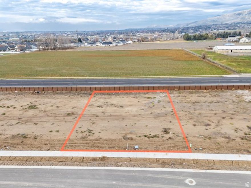 LOT 9  Smiling H Subdivision is an inviting community located in charming North Logan, Utah. This beautifully designed neighborhood offers a variety of amenities and features that cater to any lifestyle. Residents can enjoy the nearby recreational activities, including pickle ball courts, a splash pad for fun on warm days, and even an ice rink for winter sports enthusiasts. A public library and a police department nearby enhance the community's convenience and security. Families will appreciate the close proximity to schools, making it easy for children to access quality education. Additionally, every building lot is equipped with secondary water connections which is a big saver for the overall water bill. The availability of high-speed fiber internet provides residents with excellent connectivity for work and leisure. The fiber internet bill is part of the low monthly HOA fee of $65. Overall, Smiling H Subdivision offers a harmonious blend of nearby recreational opportunities and essential services, making it an ideal place to call home.