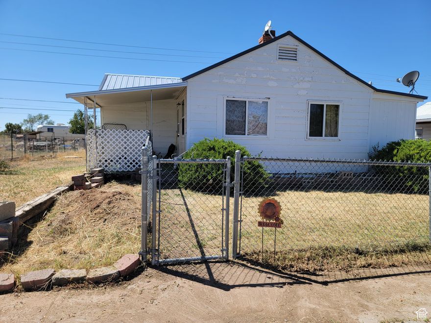 This is a cute 2 bedroom 1 bathroom home. It has potential for a 3rd bedroom in the basement. Lots of room for parking on both sides of the house. Definitely needs some TLC but is a really cute home. A huge backyard with beautiful views. Located in a small, close knit community perfect for raising a family or retirement. Whether you're looking for a primary home or an investment property, this could be the purchase for you.