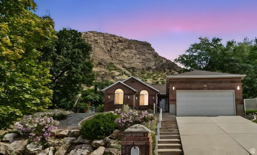See how amazing life can be living on top! Enjoy breathtaking views of the city lights while stepping right out your back door onto Ogden's best hiking trails-plus, with no backyard neighbors, you'll love the privacy. The landscaped yard is complete with xeriscaping, large mature trees, and a terraced design for beauty and low maintenance. Inside, this one-of-a-kind rambler offers a spacious open floor plan with an updated kitchen, dining nook, and convenient main-level laundry. The primary suite features a walk-in closet and ensuite bath, complemented by two additional large bedrooms on the main level. The basement includes a fully separate 2-bedroom, 1 office, 1-bath ADU with family room and kitchenette-perfect for multi-generational living or rental use. With its private walk-out entrance and past rental history, this space provides excellent versatility and income potential. Don't miss the chance to own a home that blends comfort, opportunity, and unbeatable location.  Information provided as a courtesy only, buyers and buyers agent to verify all. Square footage figures are provided as a courtesy estimate only and were obtained from County records . Buyer is advised to obtain an independent measurement.