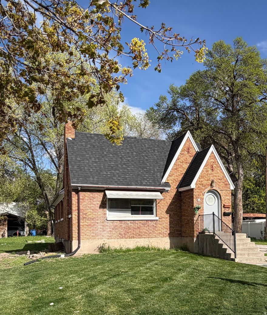 Seller is motivated to sell! Rare opportunity in the heart of Logan - two homes on one property! This grandfathered nonconforming duplex is conveniently located near grocery stores and has a strong rental history with consistent occupancy. The front home offers 2,185 sq ft with 5 bedrooms, 2 bathrooms, and 2 kitchens, providing flexible living or rental options. The second dwelling is a charming 900 sq ft, 2-bedroom, 1-bath cottage tucked privately behind the main home. Set on .56 acres, the property includes a private and spacious backyard. There is plenty of parking, and two enclosed storage units that could offer potential for additional income. Property use is limited to a duplex.