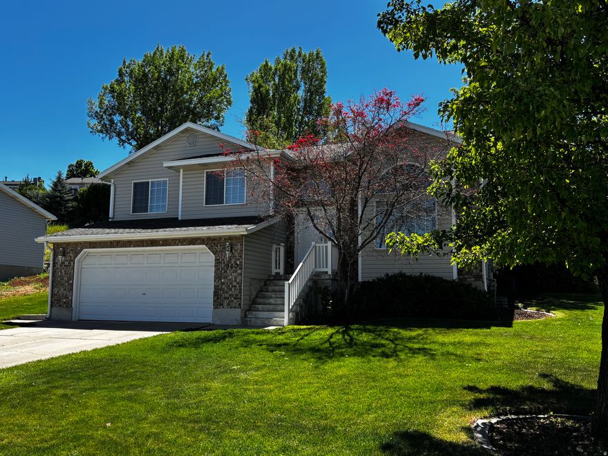 Impressive East Layton Home!  New carpet and fresh paint, updated white kitchen, quartz countertops and newer stainless appliances. Roof replaced in the last 10 years, large bedrooms with walk in closets. Basement family room with fireplace and wet bar for entertaining. Beautiful private yard, nice garage. Great location and easy to show! NOTE: Vaccant go show! Keybox on sidedoor of garage.