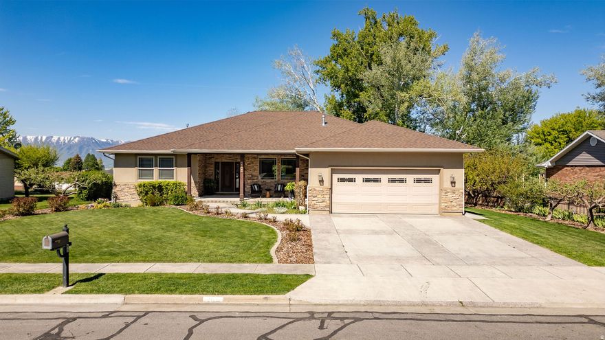 A dream come true!!! Spacious rambler on a quiet cul-de-sac offering 4 bedrooms, 3 bathrooms, and 4,837 sq ft with a hand carved front door and stained glass and potential for additional bedrooms, and multi-generational living. Unique layout features 3 kitchens-2 back-to-back upstairs and 1 downstairs in a walk-out basement ideal for an ADU setup. Yes there is laundry on both levels! Upstairs includes oven, dual sinks, dishwasher, and ample gathering space. Primary suite walks out to the deck and features a built-in headboard/dresser and laundry in the closet. Enjoy engineered wood flooring, tile kitchen floors, step-in shower, stained glass front door sidelights, and in-floor heating upstairs and downstairs. Basement includes a workout room, workshop, and second laundry area and outback has a built in storage shed. Radon mitigation system already installed. New roof completed March 2026. Mature yard includes cherry, apricot, apple, peach, and Italian plum trees plus secondary water. Buyer to verify all. Don't miss the 3D tour!