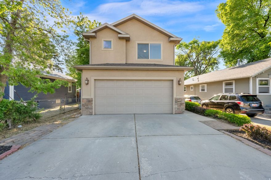 Beautiful 4 bed, 2.5 bath home in an unbeatable location just across from Nibley Park Golf Course! Enjoy quick access to parks, shopping, dining, and freeway connections while tucked into an established neighborhood setting. Inside, the bright open-concept layout is filled with natural light and designed for comfortable everyday living and entertaining. The spacious kitchen features stylish cabinetry, expansive countertops, bar seating, and seamless flow into the main living and dining areas.  Upstairs, the private primary suite offers a spa-inspired bath complete with a stunning oversized glass shower, separate soaking tub, and modern finishes throughout. Step outside to enjoy the balcony overlooking the fully fenced backyard - perfect for relaxing, entertaining, or enjoying the mature surroundings. With thoughtful updates, inviting spaces, and an ideal central location, this home combines convenience, comfort, and style all in one package.