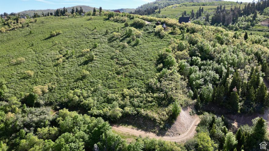 This 1.36-acre Legacy Mountain lot offers the ideal canvas for your dream mountain retreat. Set amid sweeping views of the surrounding peaks and valleys, the property combines privacy, fresh mountain air, and year-round beauty. With plenty of space for a custom build, you'll have room to create the layout, outdoor living areas, and landscaping that match your vision. Legacy Mountain's gated community provides easy access to nearby recreation, yet keeps you just minutes from the conveniences of town. Whether you envision a full-time residence or a vacation getaway, this lot delivers a rare blend of seclusion and accessibility in one of Utah's most stunning settings.
