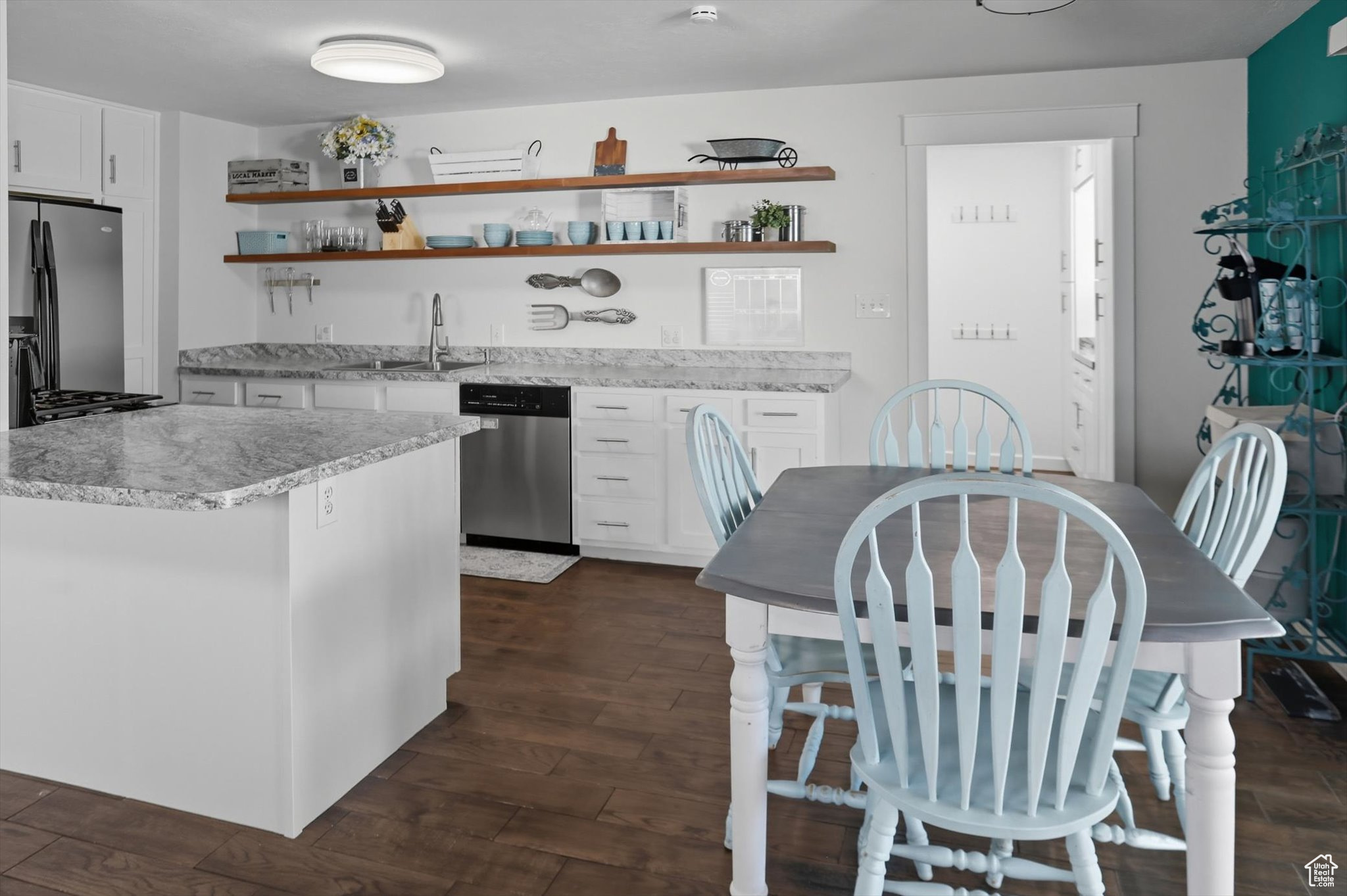 ***OPEN HOUSE SAT 4TH 12-2PM*** WELCOME HOME!!! This beautifully updated home is located in the historic North Park neighborhood right in the heart of Provo. The original house was built in 1918, but was rebuilt and updated in the seventies and has had many updates throughout the years, including one earlier this year! The open concept kitchen with stainless steel appliances now boasts brand new counters, sink, and cabinetry. The main floor bathroom has been completely renovated with heated floors, new tile, and all new lighting and plumbing fixtures. This home also features a front room with beautiful custom built-in bookshelves, and a bonus room in the basement that is perfect for a den, play room, movie room, or office space. One of the many highlights of this home is the three car pull-through garage with a full mechanic's pit, workshop, and custom shelving.Unwind on the large patio in the spacious backyard, great for entertaining. The yard features multiple fruit trees (five apple varieties, two pear, one plum), huge blackberry and raspberry bushes, an abundant pumpkin patch, and grapevines. There is also plenty of space to run and play, with the two playgrounds also being included with the sale of the home.Do not miss out on this wonderful home conveniently located within 10 minutes of both UVU and BYU; within 5 minutes to I-15 access, shopping, restaurants, historic downtown Provo, and the renowned Provo recreation center; and walking distance to multiple parks, including the Provo River walk. Book your showing today! Buyer to verify all info!