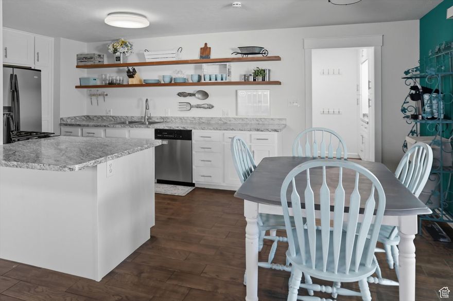 ***OPEN HOUSE SAT 4TH 12-2PM*** WELCOME HOME!!! This beautifully updated home is located in the historic North Park neighborhood right in the heart of Provo. The original house was built in 1918, but was rebuilt and updated in the seventies and has had many updates throughout the years, including one earlier this year! The open concept kitchen with stainless steel appliances now boasts brand new counters, sink, and cabinetry. The main floor bathroom has been completely renovated with heated floors, new tile, and all new lighting and plumbing fixtures. This home also features a front room with beautiful custom built-in bookshelves, and a bonus room in the basement that is perfect for a den, play room, movie room, or office space. One of the many highlights of this home is the three car pull-through garage with a full mechanic's pit, workshop, and custom shelving.Unwind on the large patio in the spacious backyard, great for entertaining. The yard features multiple fruit trees (five apple varieties, two pear, one plum), huge blackberry and raspberry bushes, an abundant pumpkin patch, and grapevines. There is also plenty of space to run and play, with the two playgrounds also being included with the sale of the home.Do not miss out on this wonderful home conveniently located within 10 minutes of both UVU and BYU; within 5 minutes to I-15 access, shopping, restaurants, historic downtown Provo, and the renowned Provo recreation center; and walking distance to multiple parks, including the Provo River walk. Book your showing today! Buyer to verify all info!