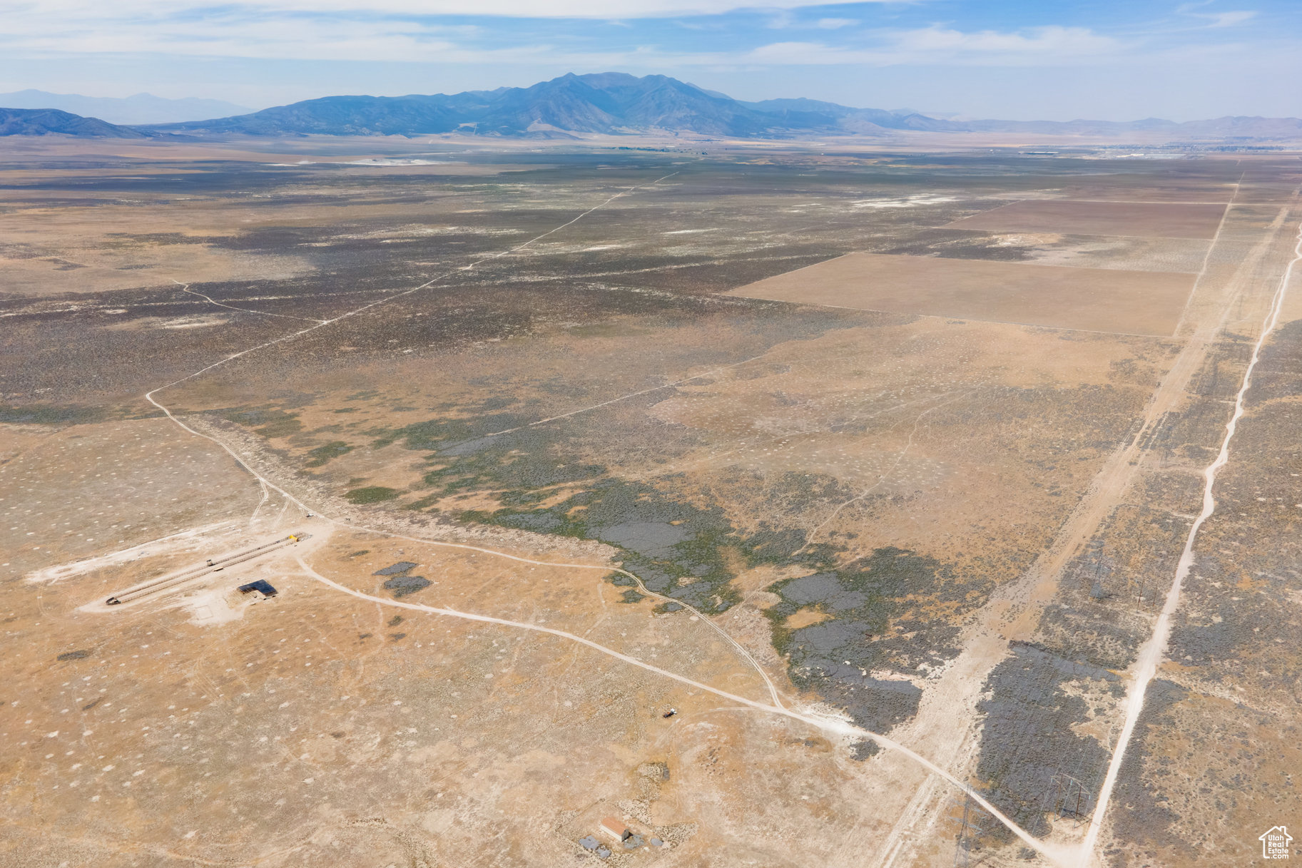 Incredible 82-acre parcel of raw land in Eagle Mountain with agricultural and residential zoning. This flat, buildable property offers sweeping views of the surrounding hills and mountains and is easily accessed via a dirt road. According to the city, Cory B Wride Hwy is planned to run directly through the parcel as development progresses, significantly increasing accessibility and long-term value. Situated in a rapidly growing region, this property is ideal for developers, builders, or investors looking to capitalize on Eagle Mountain's explosive growth. Buyer to verify utilities and development potential with the city. Directions to the Land: To access the property, you'll need a truck or an AWD vehicle. Head down Pony Express Parkway to Eagle Mountain City Center. Turn left onto East 1000 North, then right onto N. Lake Mountain Road. Continue on N. Lake Mountain Road for 4.1 miles, then turn right. After 0.1 miles, take your first left and follow that road for 2.8 miles. The 82-acre parcel will be on your right, adjacent to a barn. Be sure to plug in the coordinates: 4009'53.3"N 11200'38.2"W. Note that GPS may try to route you through Saratoga Springs, but you cannot access the land from that direction - you must approach directly through Eagle Mountain.