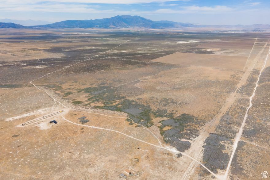 Incredible 82-acre parcel of raw land in Eagle Mountain with agricultural and residential zoning. This flat, buildable property offers sweeping views of the surrounding hills and mountains and is easily accessed via a dirt road. According to the city, Cory B Wride Hwy is planned to run directly through the parcel as development progresses, significantly increasing accessibility and long-term value. Situated in a rapidly growing region, this property is ideal for developers, builders, or investors looking to capitalize on Eagle Mountain's explosive growth. Buyer to verify utilities and development potential with the city.  Directions to the Land: To access the property, you'll need a truck or an AWD vehicle. Head down Pony Express Parkway to Eagle Mountain City Center. Turn left onto East 1000 North, then right onto N. Lake Mountain Road. Continue on N. Lake Mountain Road for 4.1 miles, then turn right. After 0.1 miles, take your first left and follow that road for 2.8 miles. The 82-acre parcel will be on your right, adjacent to a barn. Be sure to plug in the coordinates: 4009'53.3"N 11200'38.2"W. Note that GPS may try to route you through Saratoga Springs, but you cannot access the land from that direction - you must approach directly through Eagle Mountain.
