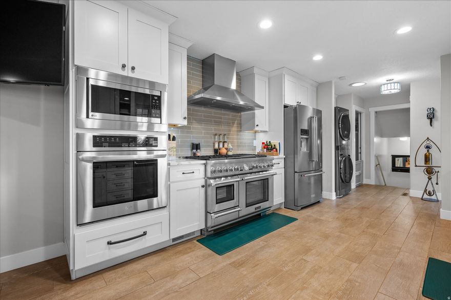 MOTIVATED SELLER! This one is not just a must-see home, it is THE must-see home! Read this, you will be glad you did! Full, professional renovation up & down, inside & out. Here is a list of new or newer items: Roof, rain gutters, furnace & AC, Renew by Andersen efficient windows, lights inside and outside front, Jellyfish lighting system around whole home and pergola ($8000!), plumbing, all electrical including new panel and new service to the home, sewer line, flooring, paint, tile. List of luxury items: 48" Thermador gas range with 6 burners, grill, warming plate and steamer, plus a second convection wall oven, Thermador dishwasher, KitchenAid refrigerator, wine/beverage refrigerator, custom kitchen cabinetry with high-end organizers and pullouts, 2 gas fireplaces, custom closets, custom built-ins in living room, upgraded carpet, wood-look tile, zero-entry shower, separate soaking tub, beautiful bathrooms, medicine cabinets in bathrooms, new blackout shades in primary bedroom, laundry on main level allowing for single level living, all new iron railings inside and outside, oversized, fully-finished garage, 220v in garage, sink in garage with hot & cold water, separate workshop area attached to garage with quartz counters, RV clean-out, dog yard with dog cleanup station, shed, circular driveway for extra parking, upgraded fencing, upgraded landscaping, covered patio, jacuzzi hot tub (just 4 years old), new pergola with fire pit. Included in the sale: All appliances (yes, all!), TV mounts & the TVs, lawn mower & snow blower, hot tub, pergola, fire pit, chairs around fire pit, firewood, plumbed Blackstone grill with deep fryer, shed. Looking for luxury living on a smaller scale? Schedule a private tour today! Square footage figures are provided as a courtesy estimate only and were obtained from 2023 appraisal. Buyer is advised to obtain an independent measurement.