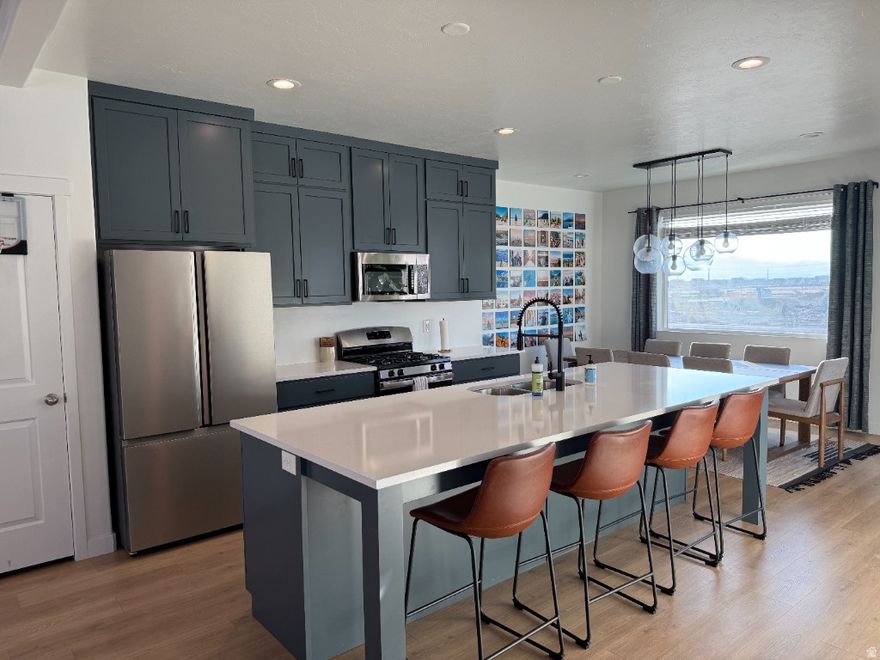 Beautiful end-unit townhome with attached 2-car garage. 1st floor features bedroom & full bath. 2nd floor offers bright, open living with kitchen & dining. 3rd floor includes owner's suite, 2 additional bedrooms, full bath & laundry. Perfect for young couples, singles, and young families. 9ft ceilings. Fridge included.