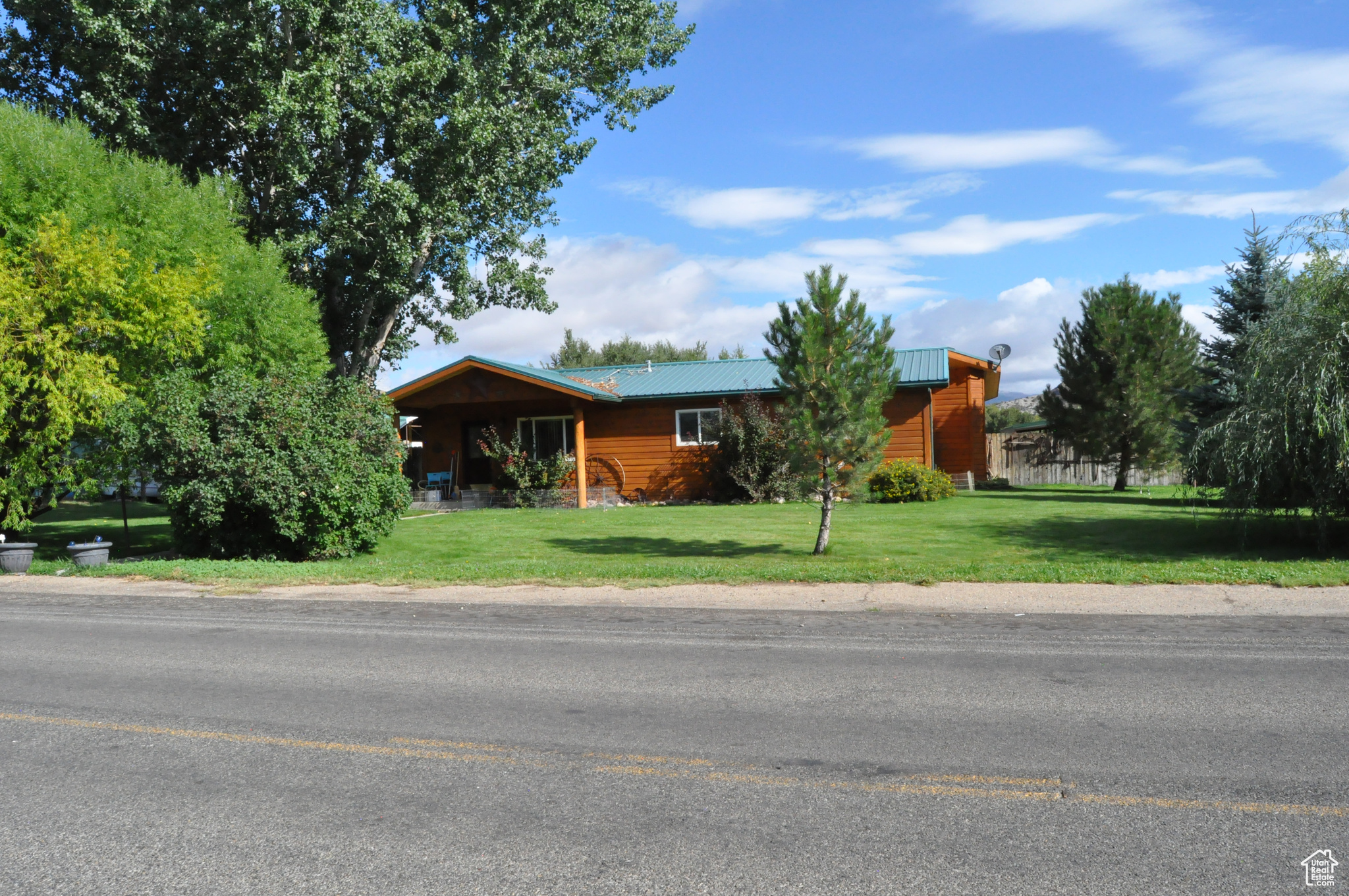 Charming Rambler on 2.12 Acres! It boasts a great location as it is located in the Ashley Maeser Area of Vernal Utah This home has been updated and remodeled 3 bedroom, 2 bath, family and living rooms offering 2,400 sq ft of comfortable living space. Features include an updated kitchen, new carpet, new interior flooring and wall and fixtures. It includes a spacious detached oversized garage and workshop and tuff shed. This beautiful parcel is fenced, with room for animals, mature trees, and beautiful mountain views. The owner has a transferable kennel license and kennels if the buyer is interested. This is horse property and includes owned water rights to Island Ditch water. This home is perfect for easy country living and is just minutes from town. Buyer to verify all information