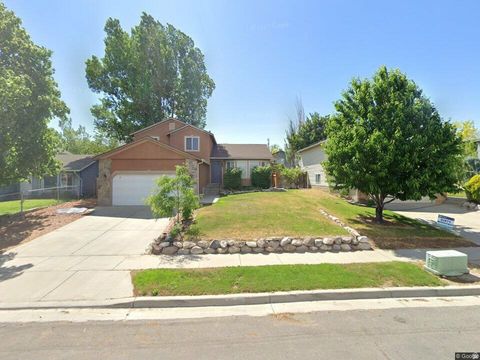 Photo of 6022 S PARK WOOD DR W, Kearns, UT 84118 (MLS # 2139198)