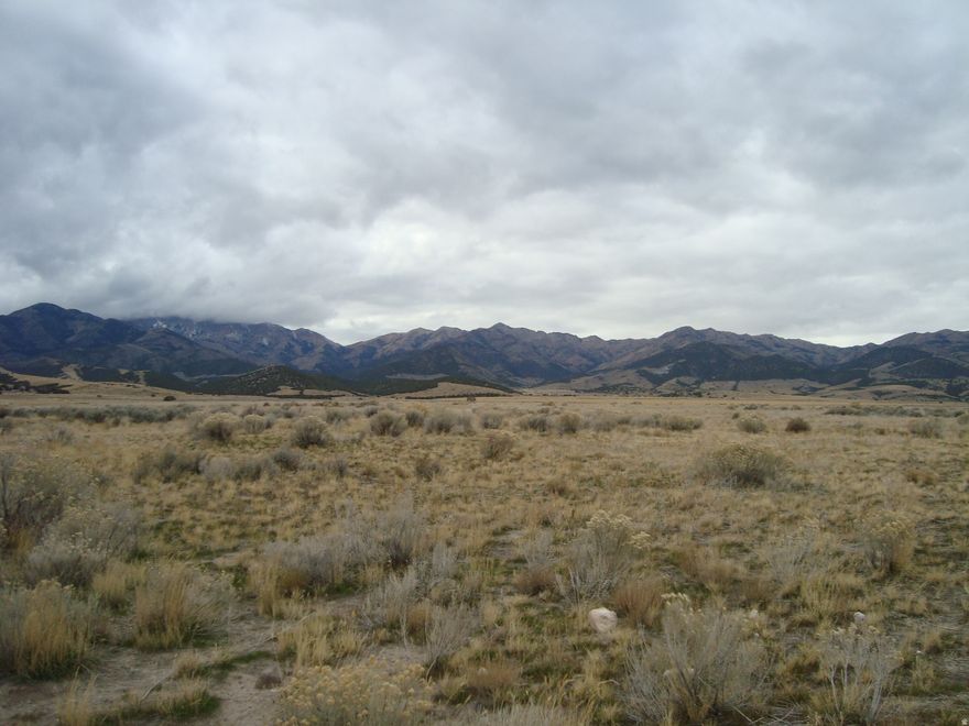 This 37 acres overlooks the entire Northern Tooele Valley, and is just 5 miles south of Grantsville, Utah and west of the Grantsville dam recreation area! Tons of possibilities for this property from a family compound to a hunting camp, or just a place to gaze at the stars. There are some Ranches south of this property along the South Willow road.