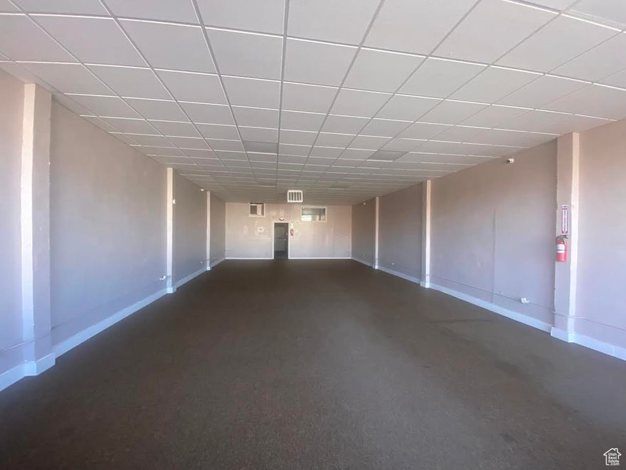 Newly remodeled retail space downtown Duchesne with frontage on Highway 40!  The current owner replaced the water, sewer, electrical, A/C,  roof, paint,  some flooring,  and added power downstairs. Then he added fencing from the back of the building to the alley. This is a great location for an existing business or starting a new one!  1875 square feet plus lots of height, a great basement area, and an upstairs office & apartment!  So many great business opportunities for this location!  It is vacant and easy to show.  This is a clean slate for your business ideas!!  Buyer to verify all square footage for building and lot.