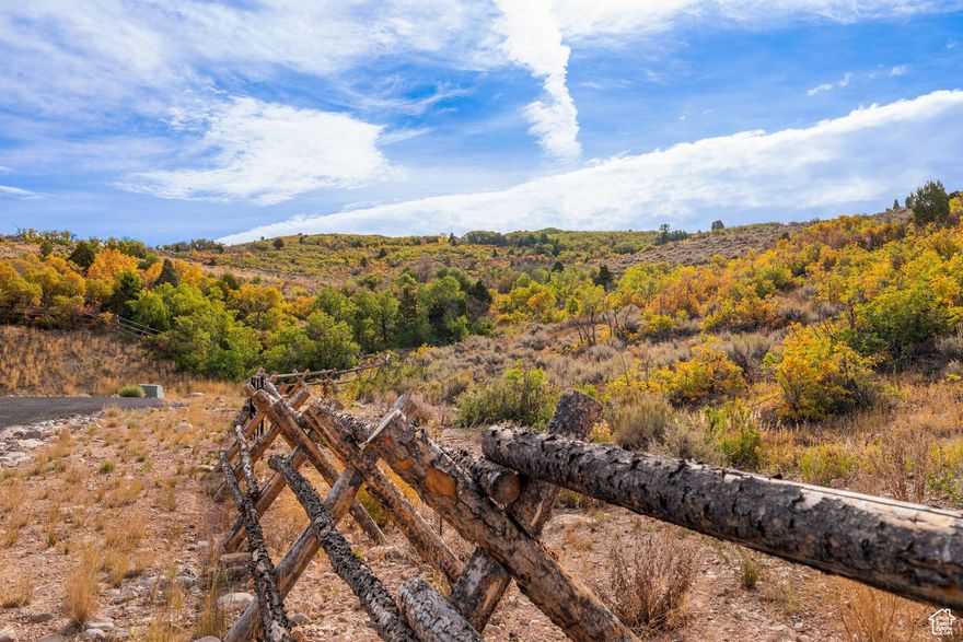 Discover the rare opportunity to own **26.17 pristine acres** in the exclusive *Blue Sage* luxury development, in the heart of Heber Valley. This extraordinary homesite offers unparalleled privacy, wide-open vistas, and the freedom to bring your lifestyle vision to life-all within minutes of world-class skiing, fly fishing, golf, and year-round outdoor recreation.  **Key Features:**  *  **Prime Location**: Tucked away in Wasatch County, just minutes from Heber City, and a short drive to Park City and Deer Valley. *  **Ready to Build**: All utilities (power, water, sewer, gas, fiber) are conveniently available at the lot line-making your dream home plans easy to bring to life. *  **Approved Building Plans Included**: The current owner has invested in beautifully designed, fully approved home plans that are included with the purchase-saving you time, money, and hassle. *  **Expansive Privacy**: No neighbors on two sides, with surrounding properties on 10-acre parcels. You're not just buying land-you're securing a private sanctuary. *  **No Subdividing**: Blue Sage is a thoughtfully planned community that ensures long-term property value and serenity. Your land is yours to preserve. *  **Incredibly Low Property Taxes**: Currently taxed at just **$8.55/year** under greenbelt status-an unmatched value in a high-demand area. *  **Freedom for Your Passions**: Whether you're into **motocross, side-by-sides, snowmobiling, snowshoeing, horseback riding, or simply enjoying wide-open nature**, this land is your playground. No HOA restrictions on your recreational lifestyle. *  **Natural Beauty**: Surrounded by mountain views, native sage, and rolling terrain that adds both character and usability to the land. *  **Connected Yet Secluded**: Experience the perfect blend of off-the-grid feeling with on-the-grid access.  **Imagine a land moat of natural serenity**, where your estate becomes a true retreat-shielded from noise and neighbors, yet close enough to the action when you want it.  This is more than a parcel-it's your legacy estate in one of Utah's most desirable mountain communities.