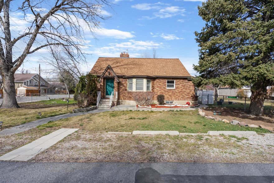 This charming six bedroom three bathroom brick bungalow has a fully finished basement and so much versatility!  Full of character and loaded with updates, this classic brick bungalow offers timeless curb appeal with mature trees, a spacious yard, two car garage, and a long driveway for plenty of parking.  Inside, the bright and open living room features rich hardwood style flooring, a fireplace, and an easy flow to the rest of the home.  With two bedrooms and one bathroom on the main floor and another bedroom on the second level, there is plenty of space to be comfortable. The fully finished basement features a kitchen, three bedrooms, one bathroom, and washer/ dryer hookups.  Enjoy outdoor time on the covered back patio in the private fenced in yard.  This well cared for home has so much to offer!