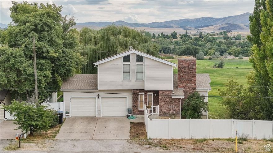 Looking for the million dollar view without the million dollar price? Come see the gorgeous view this Hyrum home has to offer from one of the three back decks. This home features three bedrooms, one that has its own loft/play space, four bathrooms, and multiple living rooms that provide great space to lounge or entertain. Kitchen features granite tile countertops and stainless steel appliances.