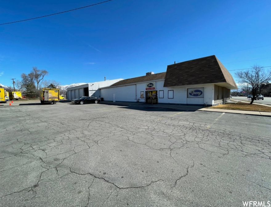 -Retail Front, 2,900 sqft     -Warehouse Rear 6,100 sq ft = 9,000 SQ FT TOTAL -1 ACRE -  Offices and Restroom between Retail and Warehouse -10 Overhead 12 ft doors, one side Loading Dock -PRIME Location on Layton's Main St. Corridor, right off I-15 Antelope Dr. exit -Pylon Sign -29+ Parking stalls -Wrap-around drive: 2 Ingress/Egress from Main St.=Drive through potential -Currently zoned C-H, use as is or potential Rezone -Contact the Agent for information and showings