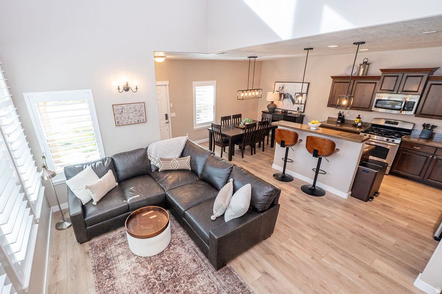 PRICE REDUCED! This beautifully maintained end-unit townhome offers the perfect blend of convenience, lifestyle, and low-maintenance living in one of Davis County's most desirable locations. Perfectly positioned near scenic trails, mountain views from the living room, and the energy of Farmington Station, this home is ideal for those who want to stay active, social, and close to everything. Imagine morning walks or bike rides along nearby trails, spontaneous dinners and shopping just minutes away, and an easy commute to Salt Lake City when work calls. Inside, the bright two-story layout offers comfortable living with an open floor plan with vaulted ceilings featuring windows with tons of natural light, a functional kitchen designed for everyday living, and 3 bedrooms including a primary suite with walk-in closet and private bath. BRAND NEW AC UNIT (2026). The attached 2-car garage and well-maintained community make daily living easy, while HOA amenities including pools, clubhouse, playgrounds, trails, and snow removal give you more time to enjoy life and helping make homeownership feel effortless. If you've been looking for a home that supports an active lifestyle, offers incredible convenience, and allows you to enjoy everything Farmington has to offer, this is it.