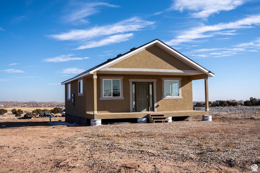 HUGE Price reduction.  Welcome to this 10-acre property offering endless potential! Located just a short drive from the town of Roosevelt, or 30 minutes to Vernal.  this flat, usable parcel comes with water rights, providing a rare and valuable resource for future development. The property features roughly 85% completed cabin, ready for you to complete and make your own. Utilities are available at the property line, though they are not currently connected. This land is being sold as-is, no repairs will be offered-giving you the opportunity to design and build to your exact specifications. There is no A/C or Heating currently for the cabin. Perfect for anyone looking to create their own private retreat or development project in a convenient location with ample space. Don't miss this chance to secure your piece of the countryside!