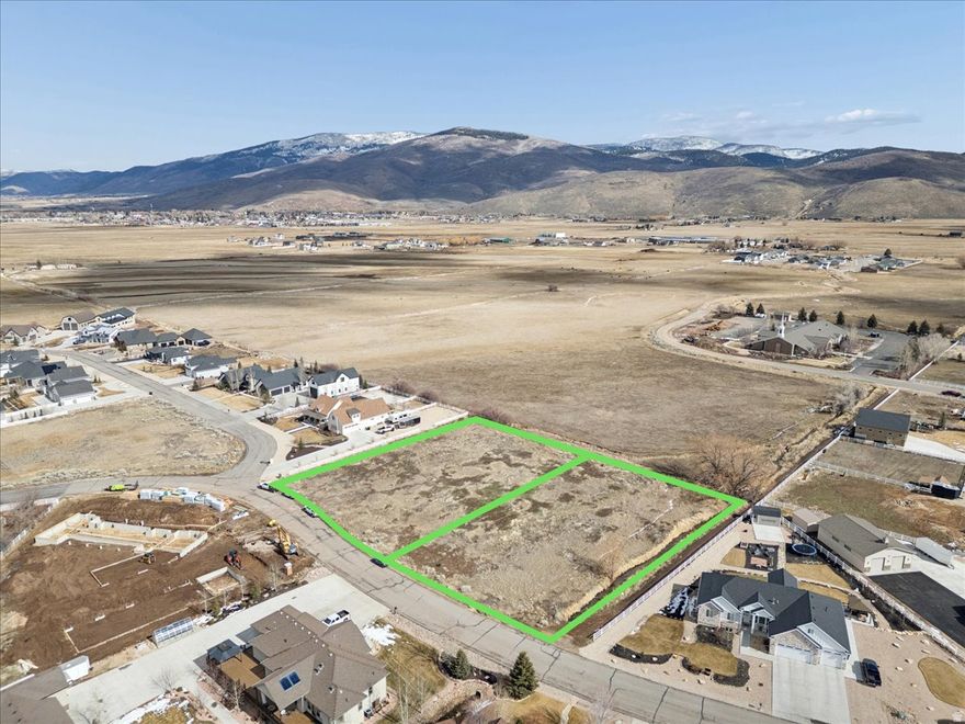 A rare opportunity to purchase two adjacent buildable lots in Wild Willow totaling approximately 2 acres in the heart of the Kamas Valley. Level, easy-to-build homesites featuring expansive mountain views and exceptional flexibility for custom home design. Build your dream home on one lot and create space for horses, a barn, or additional outbuildings on the neighboring acre. Enjoy sweeping mountain vistas, wide-open skies, and the privacy of country living while remaining just minutes to Kamas and a short drive to Park City. Easy access to the Uinta Mountains, Jordanelle Reservoir, trails, skiing, and year-round recreation. A unique chance to create a cohesive estate setting in one of the valley's most desirable neighborhoods.