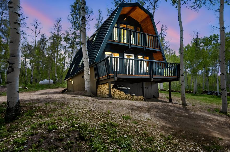 Prepare to fall in love with this incredible mountain GEM tucked away in the trees of beautiful upper Timber Lakes! Situated on a private .69-acre lot and set nearly 300 feet back from the road, this peaceful retreat offers exceptional privacy, tranquility, and breathtaking mountain views framed by towering pines and aspens. Thoughtfully renovated with tasteful modern updates, this move-in-ready cabin blends rustic mountain charm with effortless comfort and convenience. Extensive improvements include a durable 24-gauge metal roof, nine skylights that flood the home with natural light, beautifully refreshed bathrooms, pantry, laundry and mechanical rooms, plus brand-new modern plumbing throughout the entire property extending all the way to the street with a waterline buried six feet deep. Stay connected with fiber optic internet offering 300 Mbps speeds while enjoying spectacular views of the Wasatch Back & Deer Valley. Relax and entertain from three redwood decks surrounded by nature, cozy up beside the wood-burning stove, or enjoy the comfort of the propane heating system. Washer and dryer are included, plus enjoy the added bonus of free neighborhood firewood. With direct snowmobile access into the Uinta Mountains and endless year-round recreation at your fingertips, this clean, well-maintained cabin is ready for immediate enjoyment as a full-time residence or mountain getaway. This one is sure to move quickly!