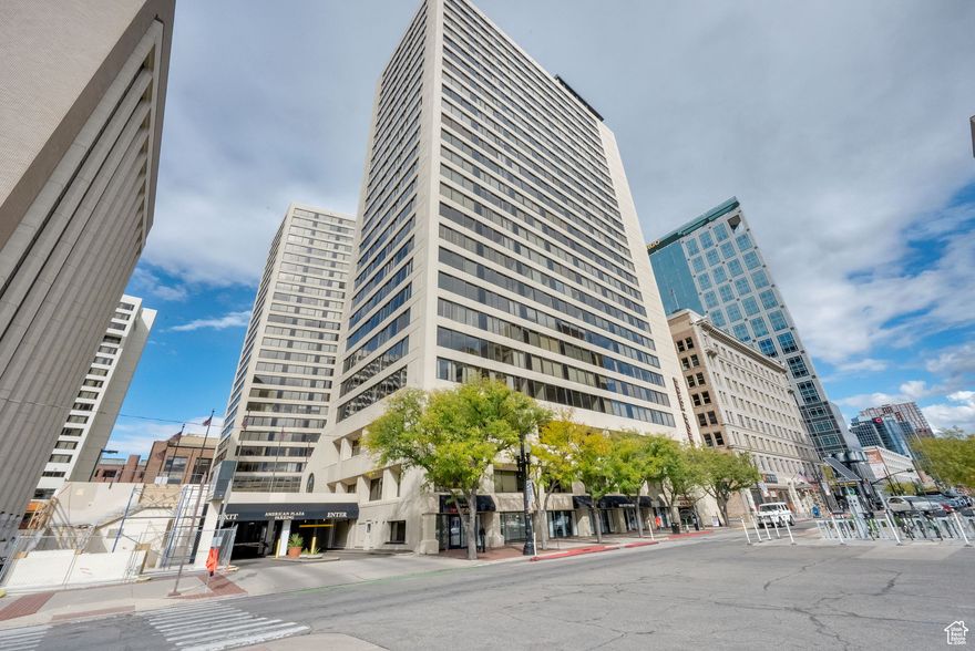 PRICE IMPROVEMENT   Enjoy sweeping valley views from this updated 15th-floor condo on the South Tower, featuring a modern kitchen with granite countertops and beautiful cabinetry. The open layout offers spacious living and dining areas, large bedrooms, and great closets. Amenities include a pool, sauna, racquetball court, rooftop entertaining area with grills, seating, hot tubs, and a kitchen, plus 24/7 security, facial-recognition entry, underground parking, fitness center, library, billiards room, and package service. Prime downtown location!  Square footage figures are provided as a courtesy estimate only and were obtained from the county.  Buyer is advised to obtain an independent measurement.