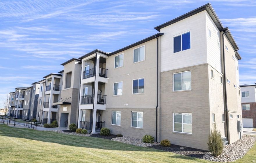 Experience luxury living at an accessible price in the prestigious Mountain Ridge community. Located directly across from Mountain View Village, this meticulously maintained 3rd-floor condo offers a rare entry point into a neighborhood where single family homes are often 800k+. As a top-floor unit, you'll enjoy the peace of having no neighbors above you, complemented by dramatic vaulted ceilings in the living room, dining area, and primary suite. This pristine home, kept in impeccable condition by the original owners (no pets/kids), features modern matte black fixtures throughout and incredible storage, including a walk-in pantry and a massive laundry storage closet. The property includes a one-car garage plus a driveway space uniquely protected by a carport-style balcony cover. Residents enjoy premium amenities like pools, gyms, and upcoming pickleball courts. Flexible closing dates available-schedule your tour today!