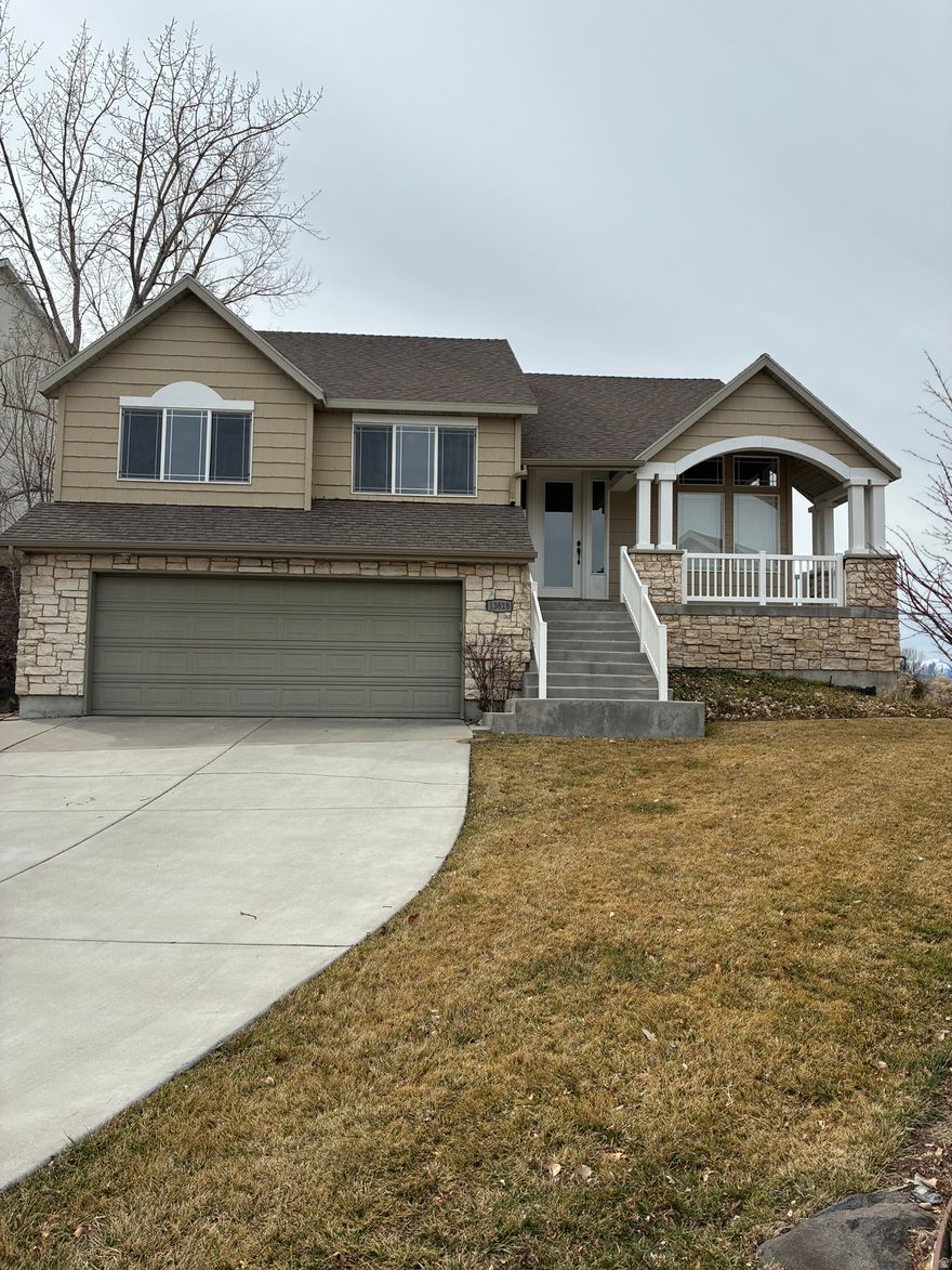 Beautiful .25 acre lot on open space with views from nearly every window, even from basement windows.  Walk or bike directly from your house to trails.  Quality neighborhood 1 mile from Draper Temple.  House has vaulted ceilings and large windows.  Over-sized garage has three parking spots (one is tandem) and extra storage area.  Fully landscaped with fencing on two sides.  New carpet, ceiling fans, and AC condenser