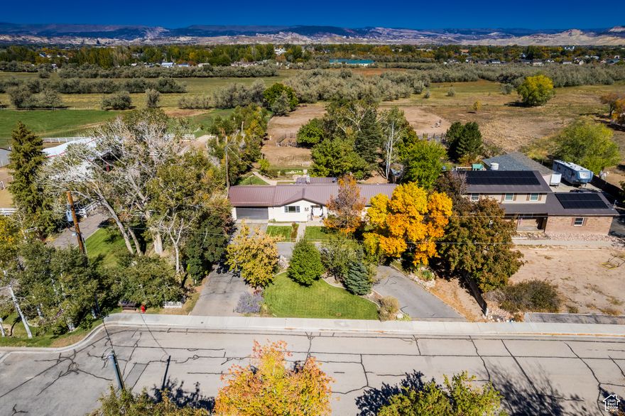 Charming 6-Bedroom Home on 1.5 Acres  The Perfect Blend of Town & Tranquility  Welcome to your dream property! This 3,300 sq. ft. home offers 6 bedrooms and 2 bathrooms, combining warmth, comfort, and functionality in a truly special setting. Flooded with natural light, the interior feels inviting and cozy-perfect for gathering with family and friends. Tucked on a quiet street, this home enjoys a central location that's just minutes from town, yet feels like a peaceful retreat. The neighborhood is highly sought after, known for its amazing neighbors and friendly community feel. Step outside and fall in love with the backyard oasis. A seasonal stream runs April through October, with charming bridges crossing over, turning the yard into a magical playground for kids and a serene escape for adults. The basement offers a separate entrance, making it ideal for extended family or rental potential. It features its own master suite with a full bath, an additional bedroom, and space for a kitchen-creating a fantastic investment opportunity or multi-generational living setup. The property spans 1.5 acres and includes 2 water shares, an established garden, a chicken coop, and 4 outdoor sheds, giving you plenty of room to live sustainably and enjoy the outdoors. Don't miss your chance to own this rare gem that perfectly balances convenience, comfort, and country charm.  Square footage figures are provided as a courtesy estimate only. Buyer is advised to obtain an independent measurement.