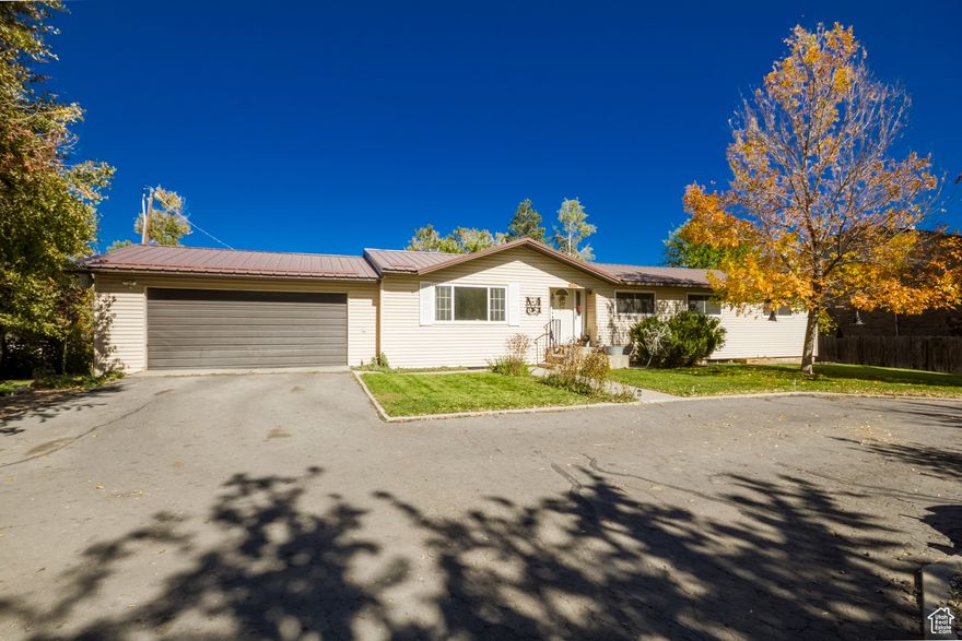 Charming 6-Bedroom Home on 1.5 Acres  The Perfect Blend of Town & Tranquility  Welcome to your dream property! This 3,300 sq. ft. home offers 6 bedrooms and 2 bathrooms, combining warmth, comfort, and functionality in a truly special setting. Flooded with natural light, the interior feels inviting and cozy-perfect for gathering with family and friends. Tucked on a quiet street, this home enjoys a central location that's just minutes from town, yet feels like a peaceful retreat. The neighborhood is highly sought after, known for its amazing neighbors and friendly community feel. Step outside and fall in love with the backyard oasis. A seasonal stream runs April through October, with charming bridges crossing over, turning the yard into a magical playground for kids and a serene escape for adults. The basement offers a separate entrance, making it ideal for extended family or rental potential. It features its own master suite with a full bath, an additional bedroom, and space for a kitchen-creating a fantastic investment opportunity or multi-generational living setup. The property spans 1.5 acres and includes 2 water shares, an established garden, a chicken coop, and 4 outdoor sheds, giving you plenty of room to live sustainably and enjoy the outdoors. Don't miss your chance to own this rare gem that perfectly balances convenience, comfort, and country charm.  Square footage figures are provided as a courtesy estimate only. Buyer is advised to obtain an independent measurement.