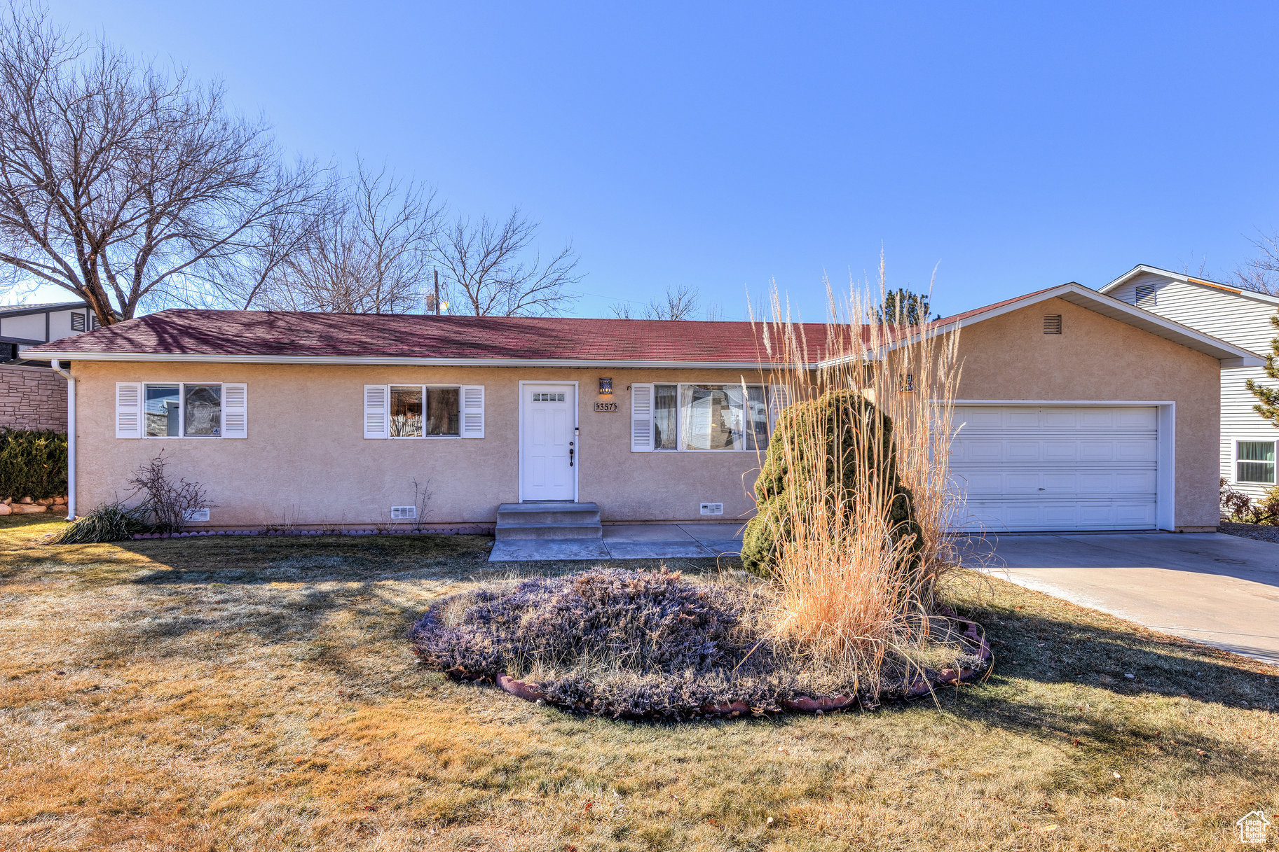 Welcome to this inviting three-bedroom, 1  bathroom home located on a quiet street close to downtown Moab, schools, churches, and the aquatic center. Step inside to find fresh carpet and newly updated bathroom floors, updated fixtures, and a new range- creating a clean, move-in-ready space. The kitchen exudes a delightful Southwest vibe, complementing the home's cozy and charming atmosphere. This home offers practicality and comfort with a spacious garage featuring ample storage, a utility sink, and a separate laundry room. The built-in porch/sunroom is perfect for year-round enjoyment, while central air ensures your comfort in every season. The large fenced-in backyard includes a garden shed and offers plenty of space for outdoor activities, gardening, or simply relaxing. Whether you're seeking modern updates, a convenient location, or an outdoor space to enjoy, this home has it all!