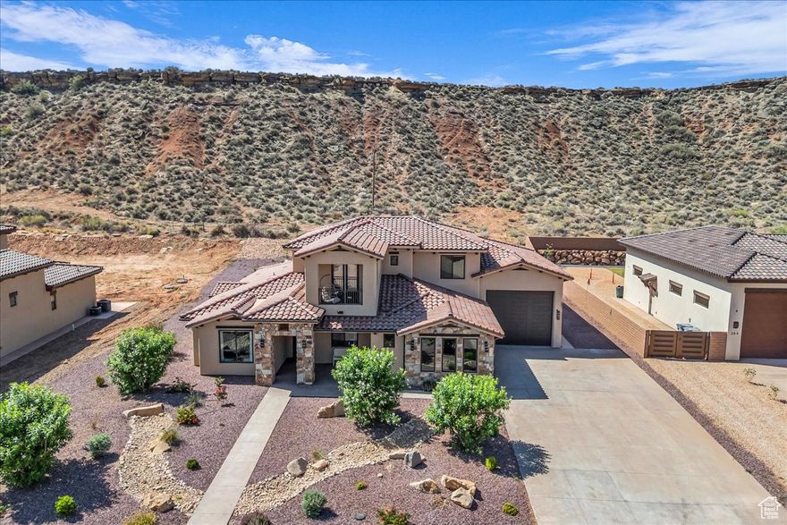 Come see this incredible property that offers great views! Located just 10 minutes from Zion National Park. This stunning home features exquisite modern finishes throughout, include wood flooring, high ceilings, open living room with floor to ceiling fireplace and large windows just to name a few. Chefs kitchen that features high end appliances, quartz countertops, large island, custom cabinetry and butlers pantry. Upstairs offers an oversized family room. The backyard provides ample space with no neighbors behind and great views of the Mesa.