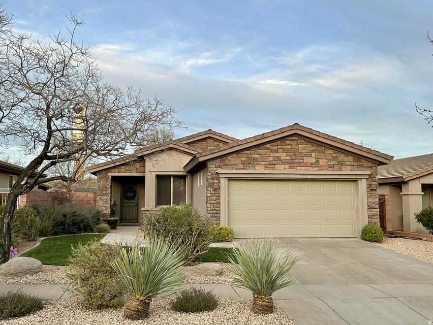 This well-maintained single-family home offers 3 bedrooms & 2 bathrooms in the highly desirable Coral Canyon community. Relax in a spacious, fully fenced backyard with a covered patio - backing directly to open space for added privacy. Enjoy access to amenities including pools, parks, pickleball, tennis, trails, an exercise room, & more. Conveniently located near I-15 & State Route 9, with quick access to top golf courses, Sand Hollow Reservoir, Quail Creek State Park, & just 50 minutes from Zion National Park. The home features a tankless water heater, spacious storage closet, & a 1-year-old shed for added functionality. Recent updates include a new sink, faucet, water softener, toilets, water pressure regulator, attic fan in the garage, & a metal screen door. Solar screens on the south & east windows help improve efficiency, making this home as practical as it is comfortable.