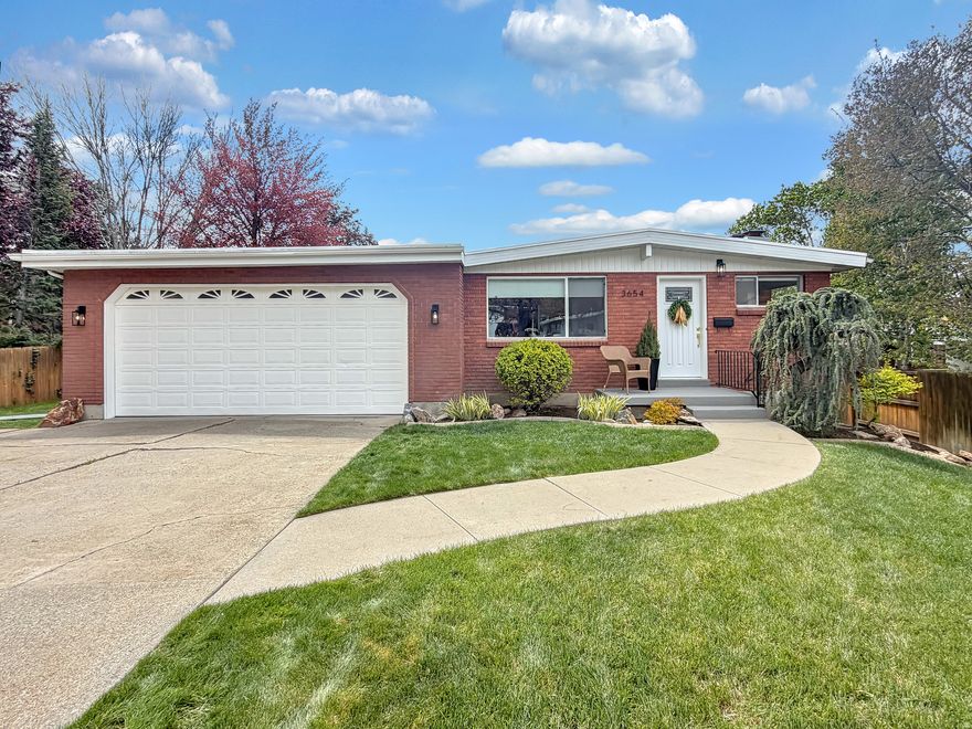 Located in the highly sought-after Olympus Cove neighborhood, this beautifully updated brick rambler blends timeless mid century modern charm with thoughtful, modern upgrades. Clean lines, expansive windows, and an open, airy feel create a light filled living experience throughout, enhanced by large picture windows and daylight basement windows that bring in an abundance of natural light on both levels. Real hardwood floors, original cabinetry and woodwork, and striking redwood accent walls on the exterior add warmth, character, and authentic mid century appeal.  The main living space features a cozy gas fireplace and flows seamlessly into an updated kitchen with sleek quartz countertops, offering both style and functionality. Downstairs, a massive family room provides the perfect gathering space, with walk out basement access, ideal for entertaining or relaxing. Outside, tucked in the foothills of Mt. Olympus, this home truly shines with a beautifully landscaped yard filled with mature trees that provide shade and privacy. An expansive terraced deck with a pergola creates the ultimate outdoor retreat, perfect for summer evenings, entertaining guests, or simply enjoying the serene surroundings. The perfect blend of nature, comfort, and charm in this inviting, mid century modern gem.