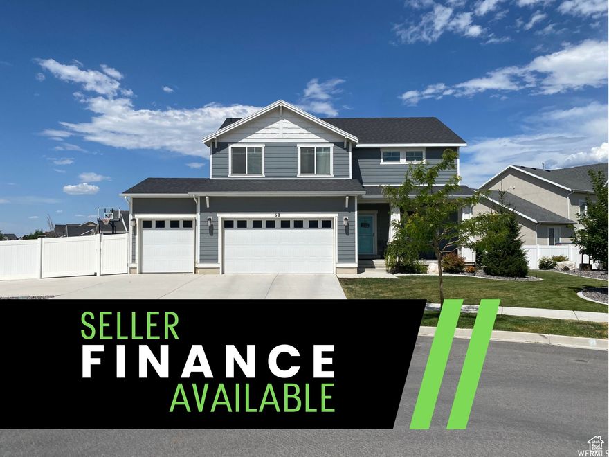Seller Financing available at a 4.95% fixed rate with a large down payment! Tucked in a quiet cul-de-sac in Legacy Farms subdivision. This beautifully two-story home offers comfort, function. The open-concept main floor seamlessly connects the kitchen, dining, and great room. Enjoy stainless steel appliances, staggered cabinetry, and a large island perfect for gathering. The great room features a cozy fireplace, and the custom mudroom adds everyday convenience with built-in storage. The finished basement includes space to entertain and a whimsical under-stairs playroom. Step outside into a true backyard retreat, complete with a built-in gas fireplace, seating area, in-ground trampoline, playset, and basketball stand, with RV parking, and a 3-car garage. Less than one block from the elementary school and 2 blocks from the community pool. Minutes from shopping, dining, and Pioneer Crossing for I-15 access.